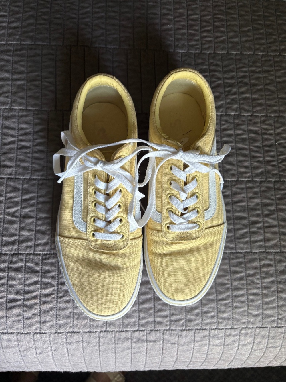 Yellow Vans off the wall.